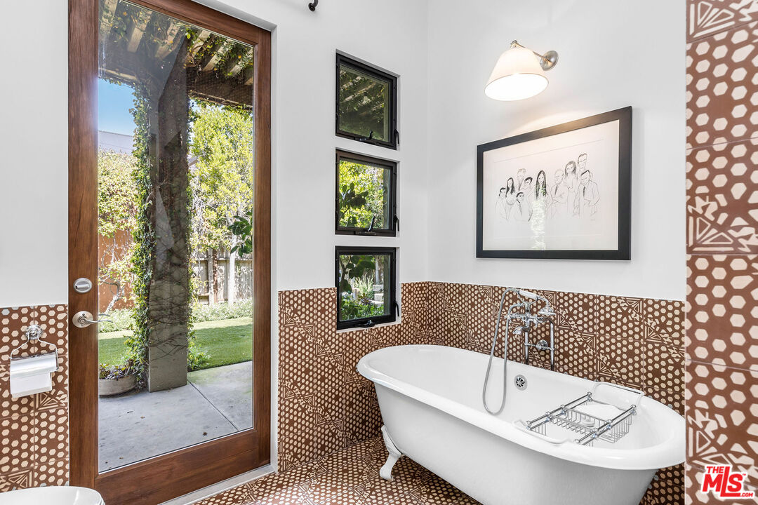 2211 Glencoe Avenue Venice, CA 90291 - Photo 13 of 19 a bathroom with a bathtub and a shower