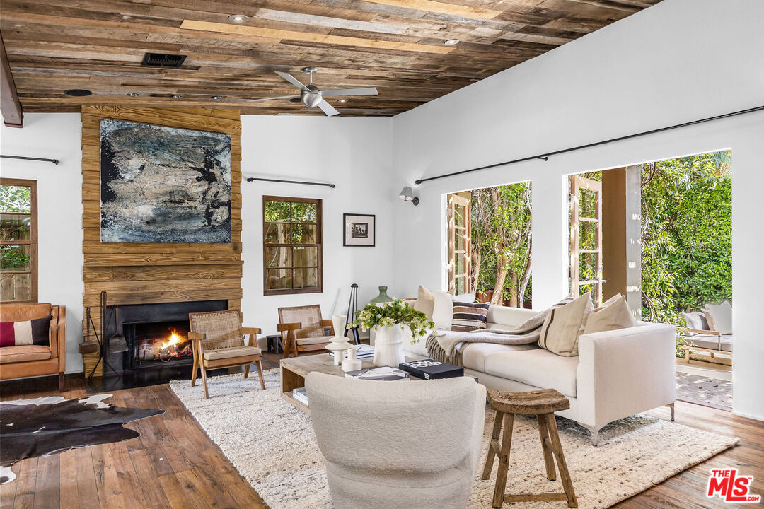 2211 Glencoe Avenue Venice, CA 90291 - Photo 2 of 19 a living room with furniture and a fireplace