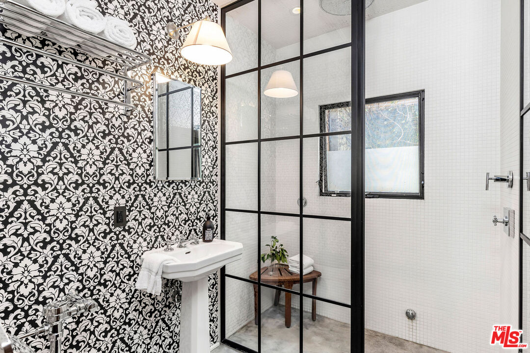 2211 Glencoe Avenue Venice, CA 90291 - Photo 6 of 19 a bathroom with a sink and mirror with toilet
