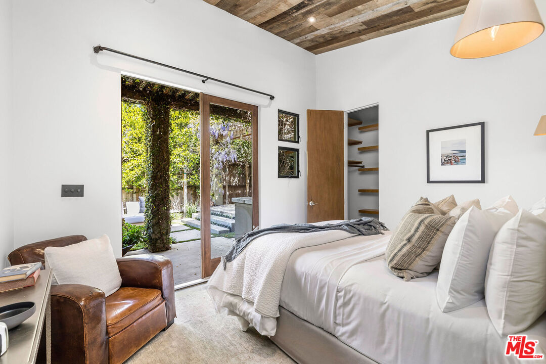 2211 Glencoe Avenue Venice, CA 90291 - Photo 8 of 19 a bedroom with furniture and a window