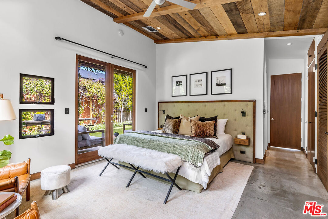 2211 Glencoe Avenue Venice, CA 90291 - Photo 9 of 19 a bedroom with a bed and a large window