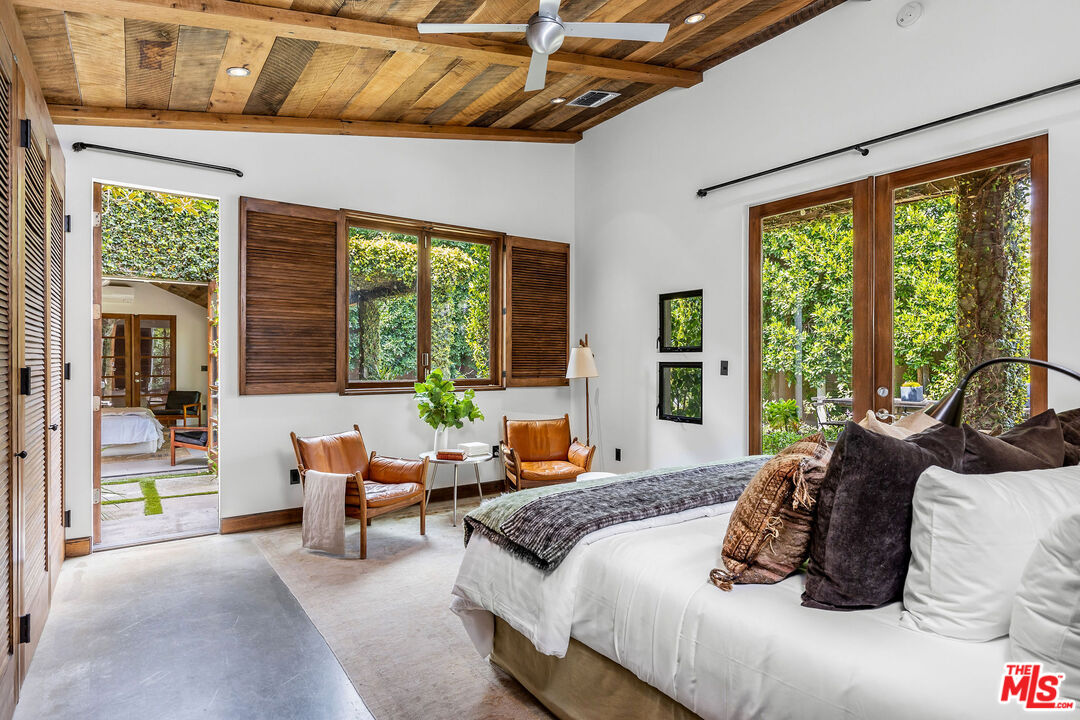 2211 Glencoe Avenue Venice, CA 90291 - Photo 10 of 19 a bedroom with furniture and large windows