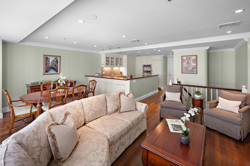 300 Boylston Street, Unit 909 Boston, MA 02116 - Photo 11 of 18 a living room with furniture and wooden floor