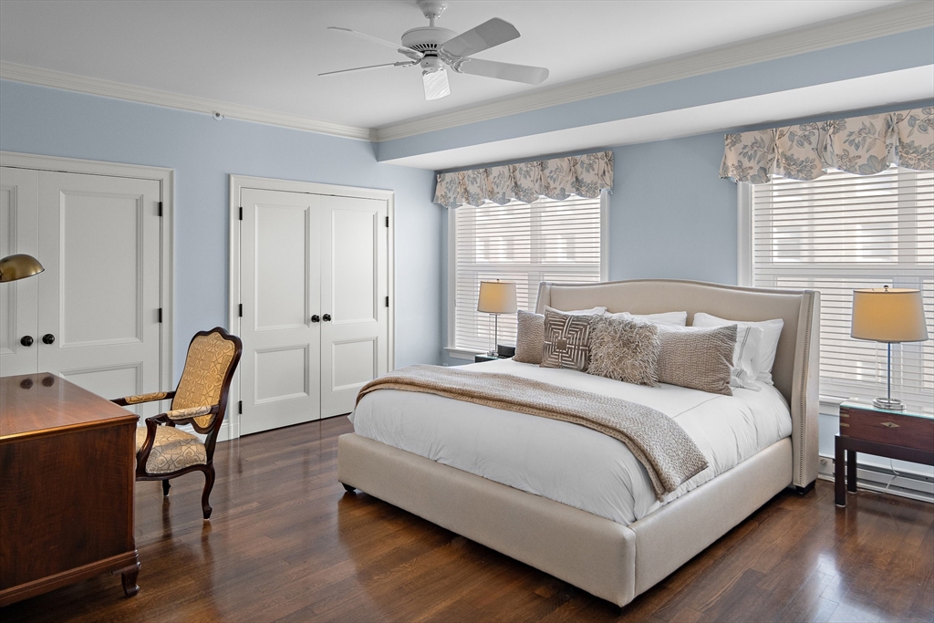 300 Boylston Street, Unit 909 Boston, MA 02116 - Photo 13 of 18 a bedroom with a bed a chair and a window