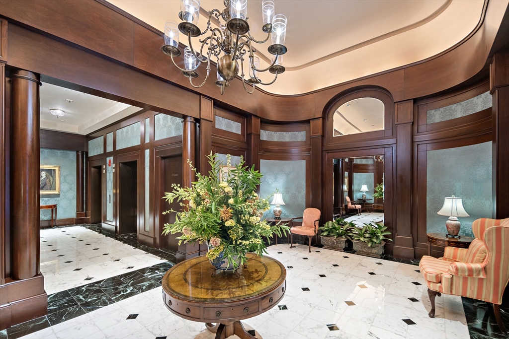 300 Boylston Street, Unit 909 Boston, MA 02116 - Photo 18 of 18 a view of a dining room with furniture and a chandelier