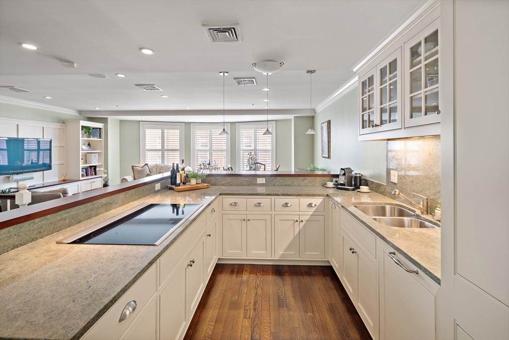 300 Boylston Street, Unit 909 Boston, MA 02116 - Photo 4 of 18 a large white kitchen with a large window
