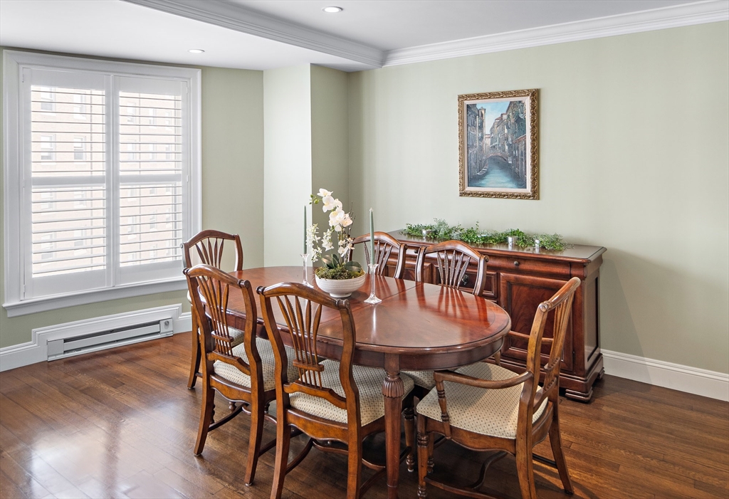 300 Boylston Street, Unit 909 Boston, MA 02116 - Photo 9 of 18 a view of a dining room with furniture and wooden floor