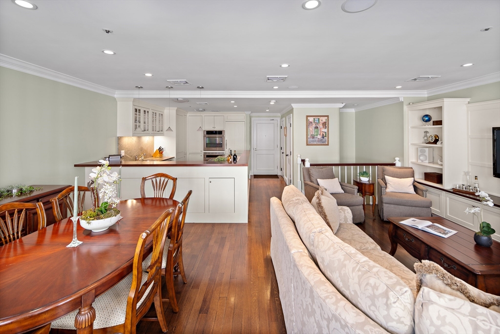 300 Boylston Street, Unit 909 Boston, MA 02116 - Photo 10 of 18 a view of a dining room with furniture and wooden floor