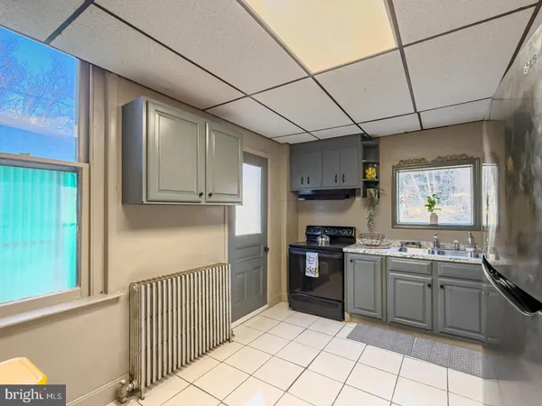 a kitchen with stainless steel appliances granite countertop a sink and cabinets