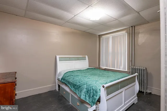 a room with a bed and a window