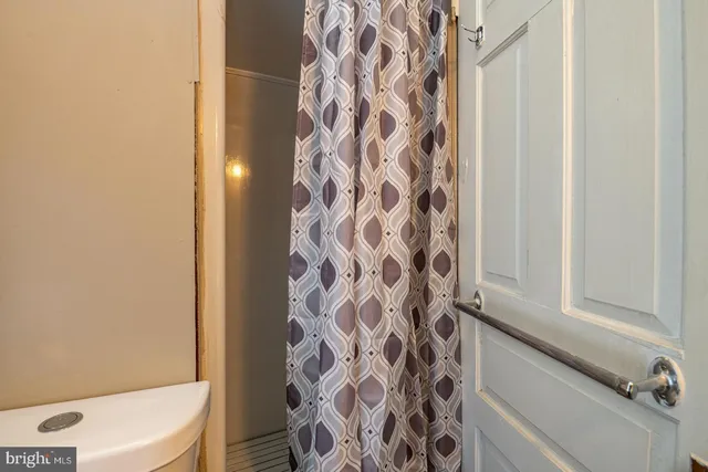 a bathroom with a bathtub and shower