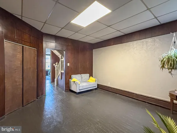 a lobby with furniture and a potted plant