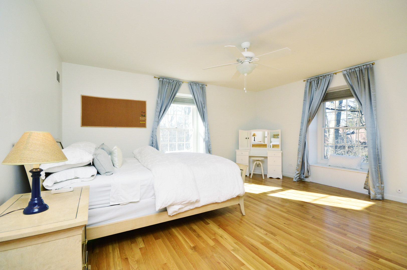 644 Hunter Road Glenview, IL 60025 - Photo 22 of 32 a bedroom with a bed and a large window with the outer view