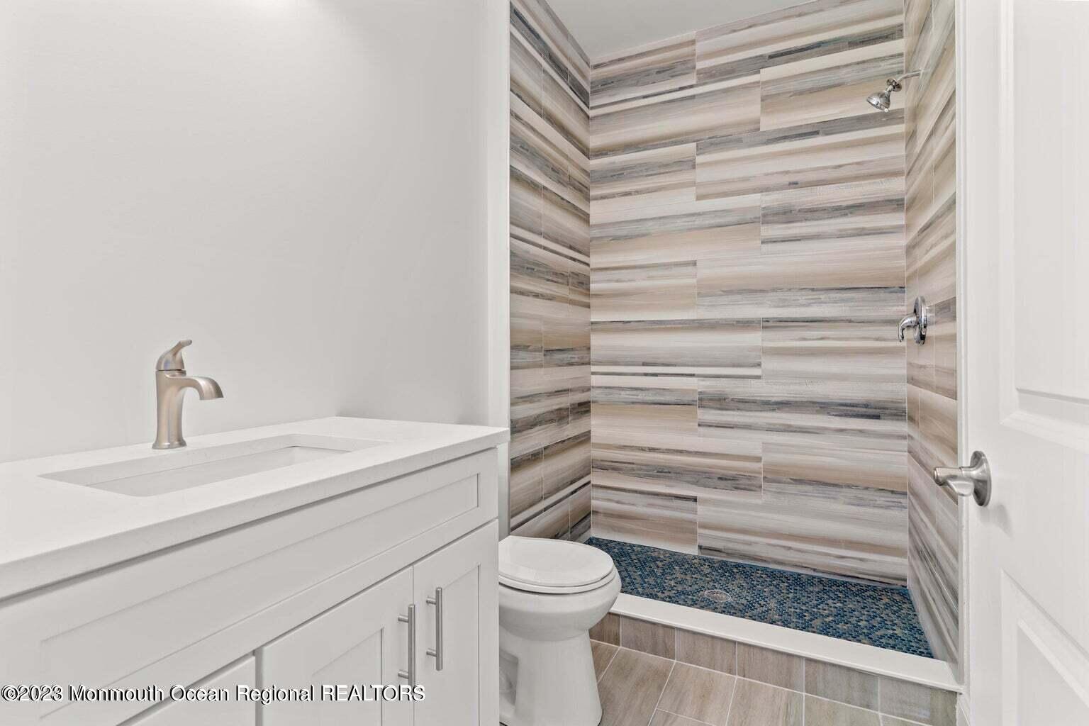 61 Hamilton Avenue Seaside Heights, NJ 08751 - Photo 13 of 31 a bathroom with a sink toilet and shower