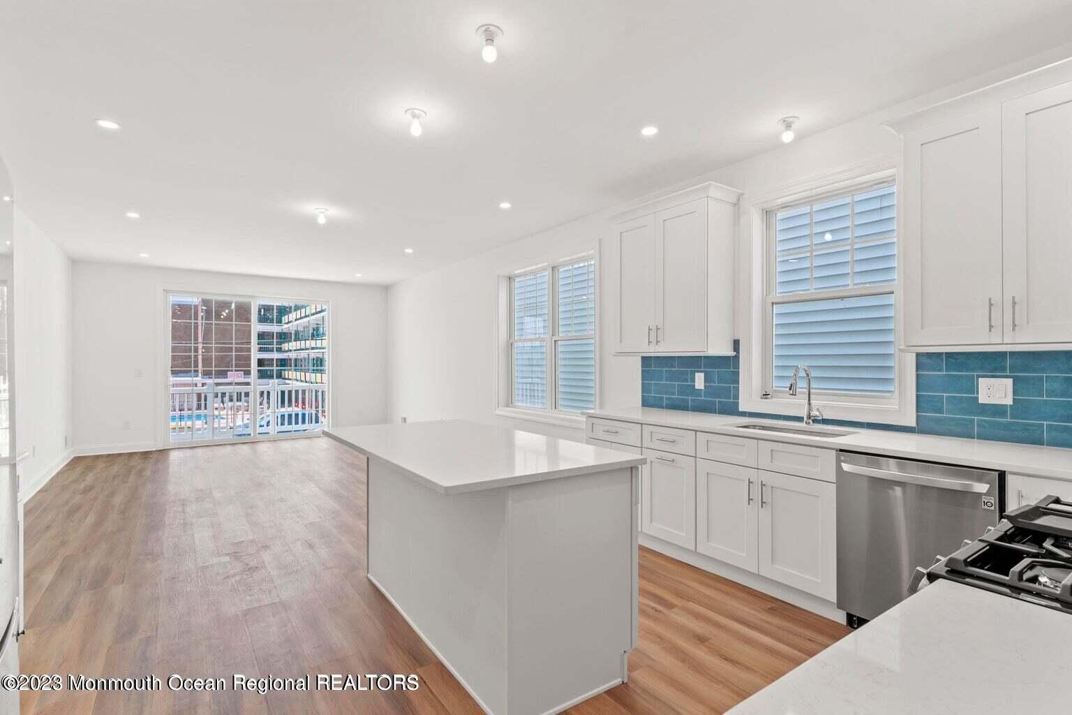 61 Hamilton Avenue Seaside Heights, NJ 08751 - Photo 6 of 31 a large kitchen with stainless steel appliances granite countertop a sink and a stove