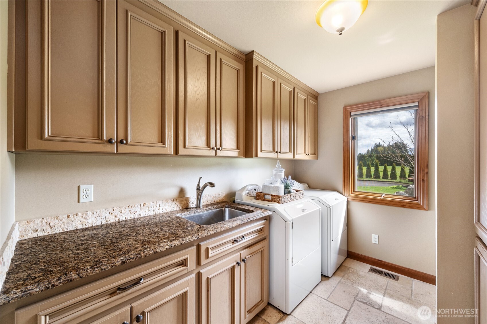 770 East Wiser Lake Road Lynden, WA 98264 - Photo 15 of 36 a kitchen with stainless steel appliances granite countertop a sink stove and cabinets