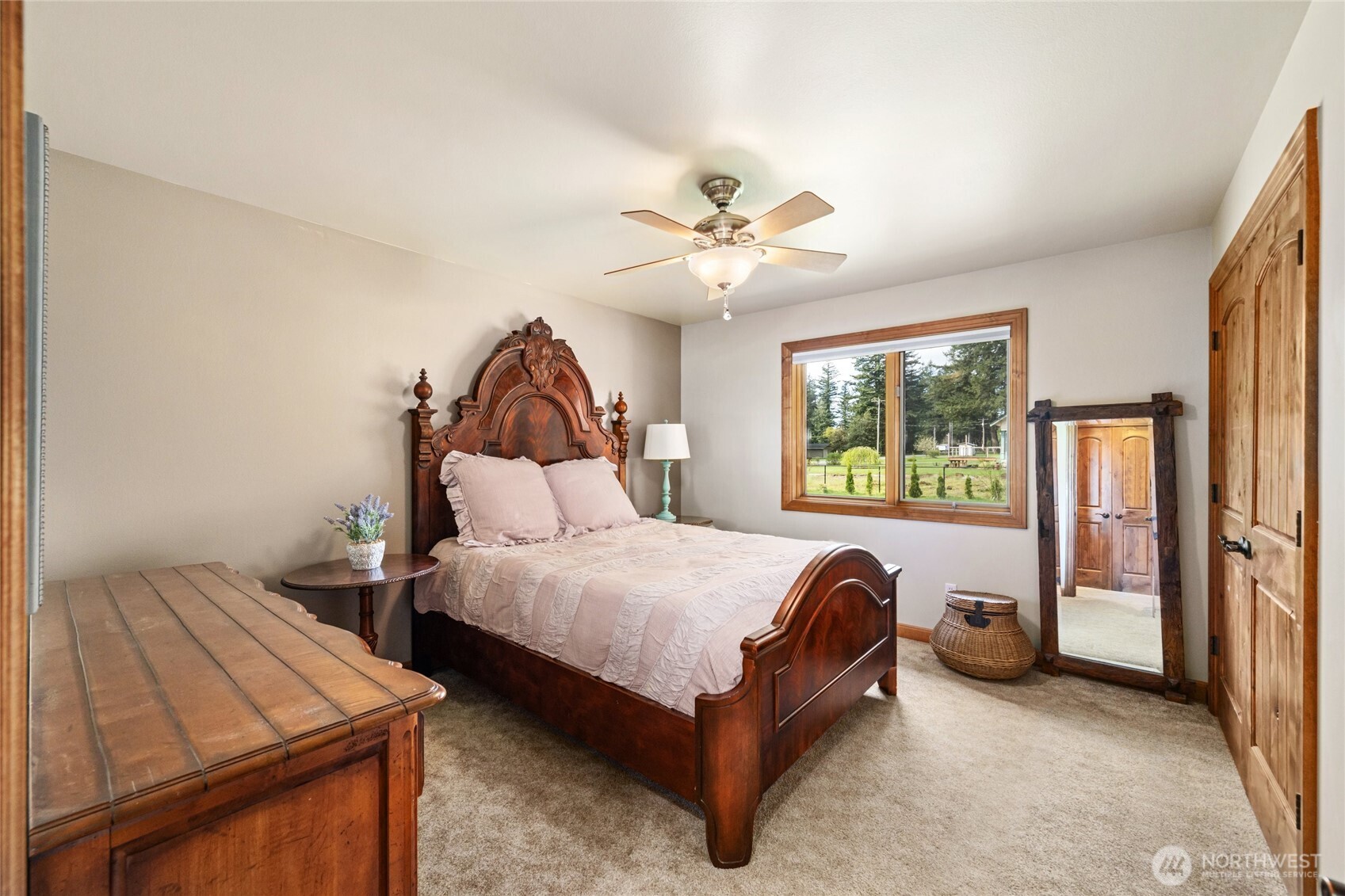 770 East Wiser Lake Road Lynden, WA 98264 - Photo 16 of 36 a bed room with a bed and a chandelier