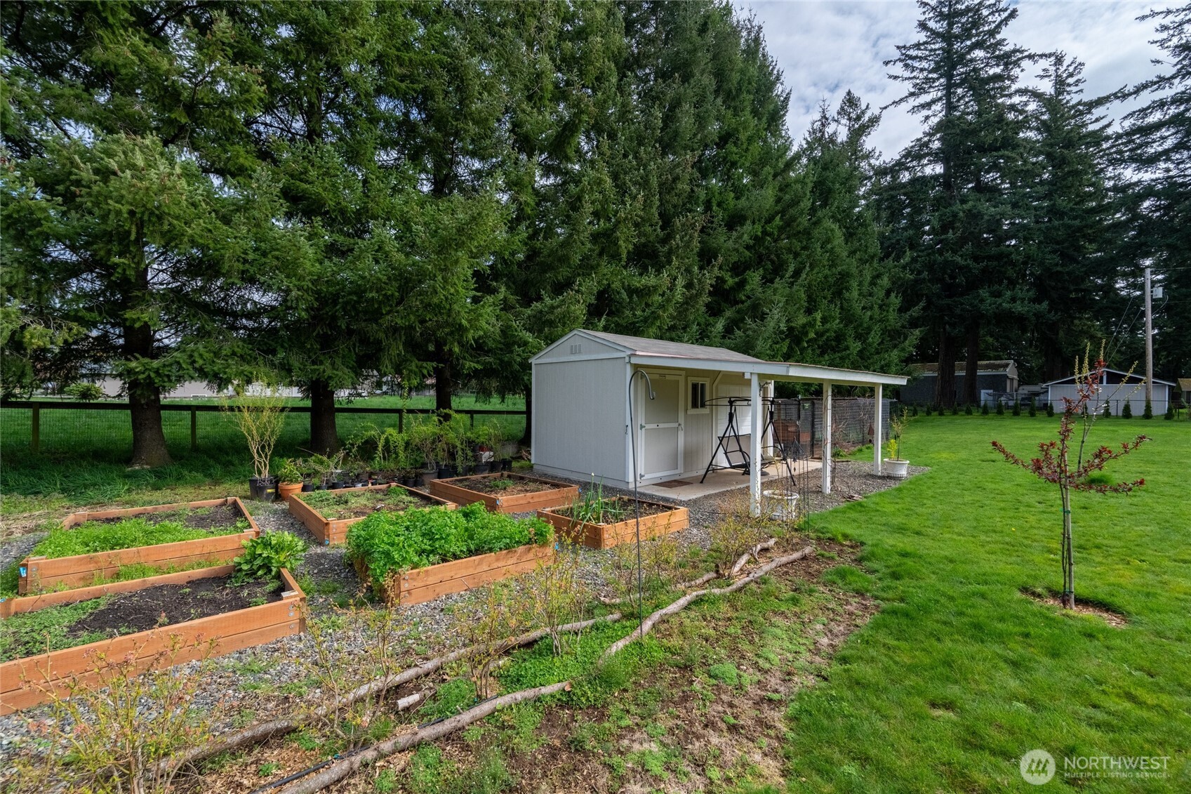 770 East Wiser Lake Road Lynden, WA 98264 - Photo 26 of 36 a view of a house with backyard and sitting area