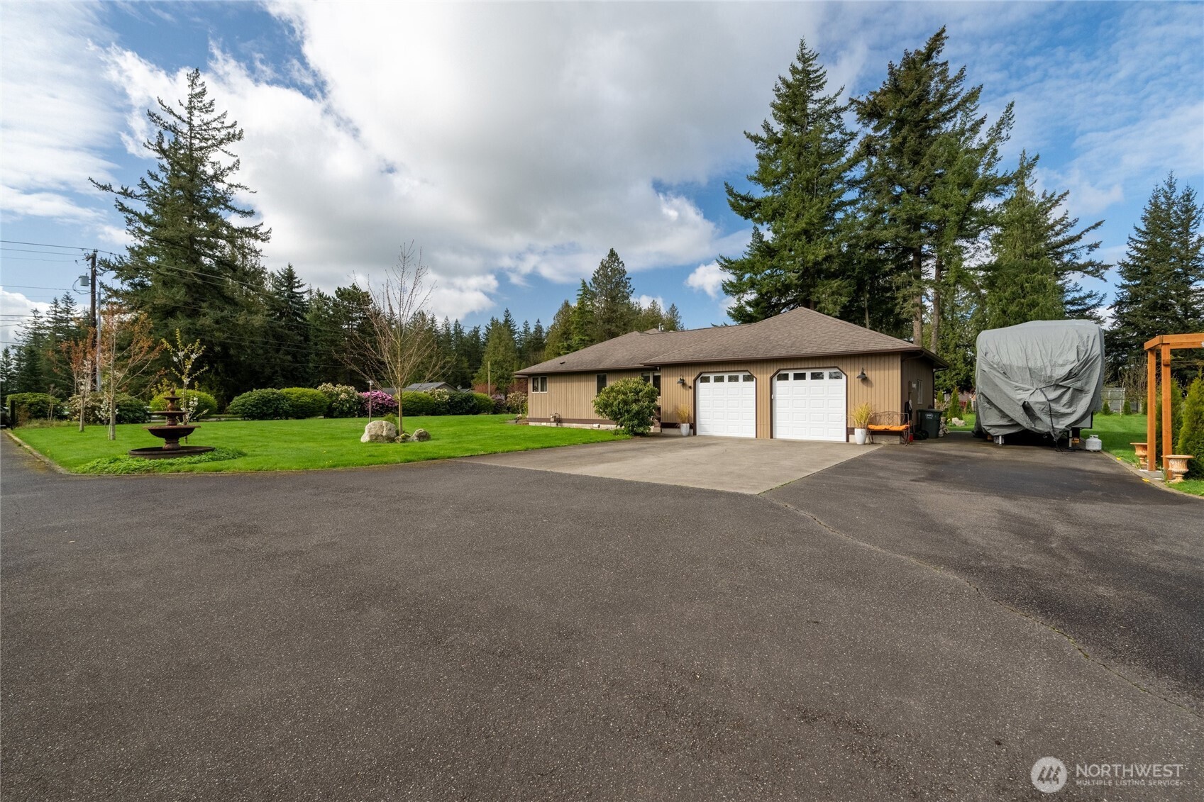 770 East Wiser Lake Road Lynden, WA 98264 - Photo 29 of 36 a front view of a house with garden