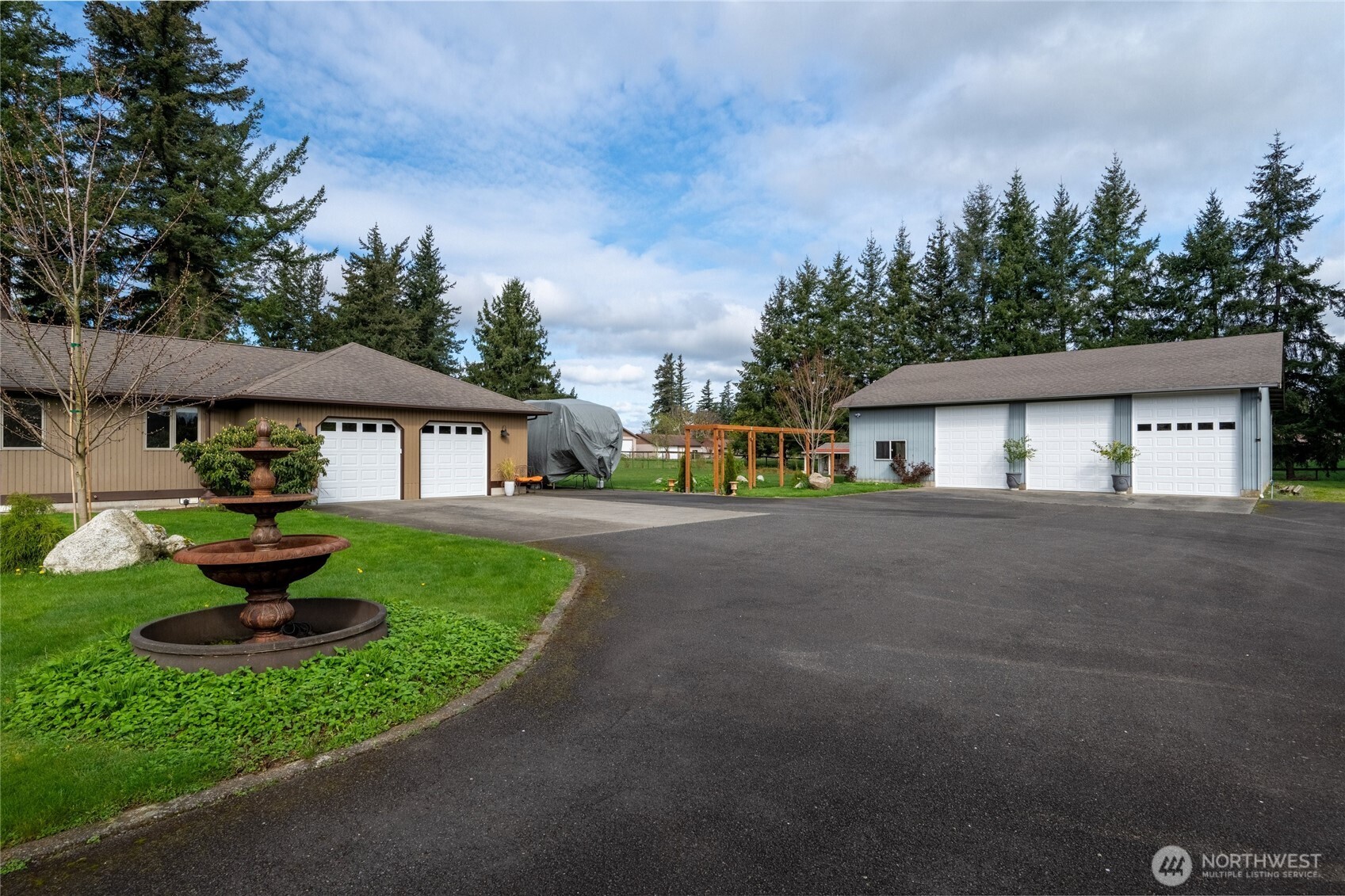 770 East Wiser Lake Road Lynden, WA 98264 - Photo 30 of 36 a front view of a house with a garden