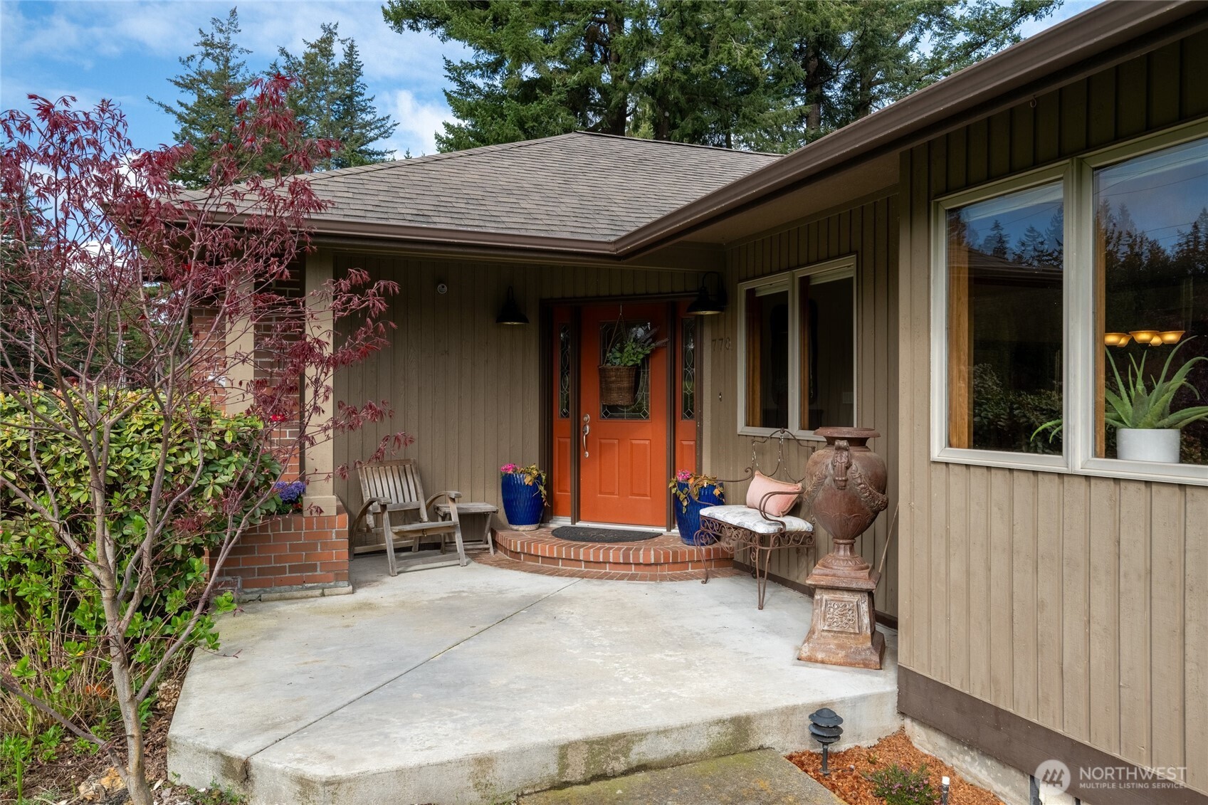 770 East Wiser Lake Road Lynden, WA 98264 - Photo 4 of 36 a patio with table and chairs and potted plants