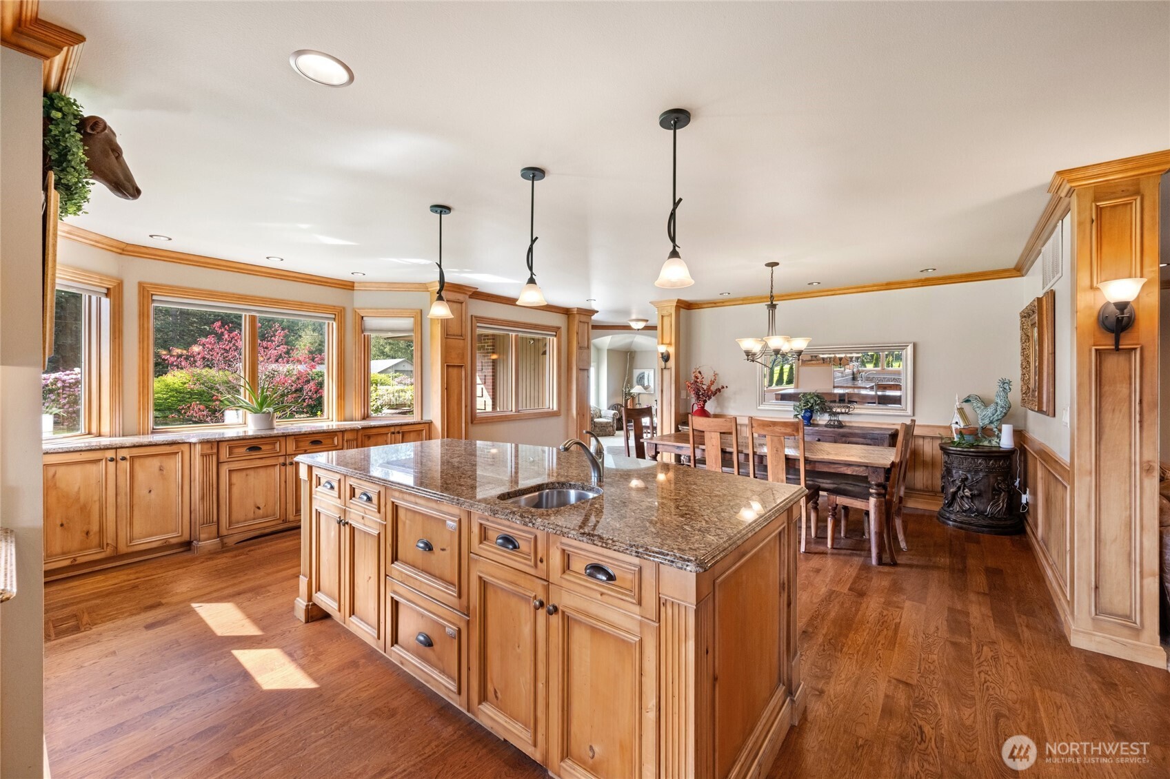 770 East Wiser Lake Road Lynden, WA 98264 - Photo 7 of 36 a kitchen with stainless steel appliances granite countertop a lot of counter space and wooden floors