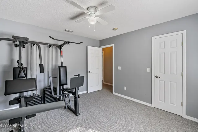 a view of an house with backyard space and garden