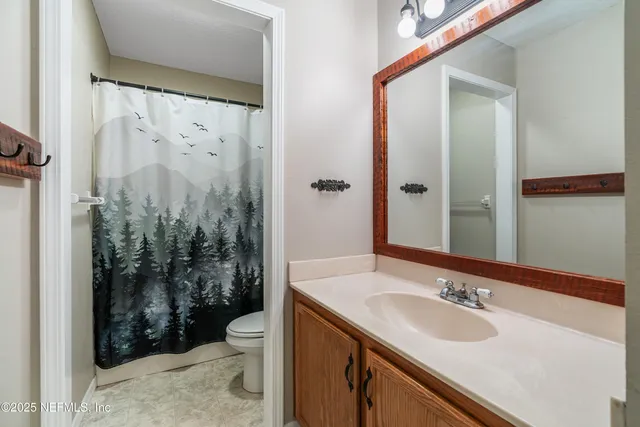 a view of a chair and table in the patio