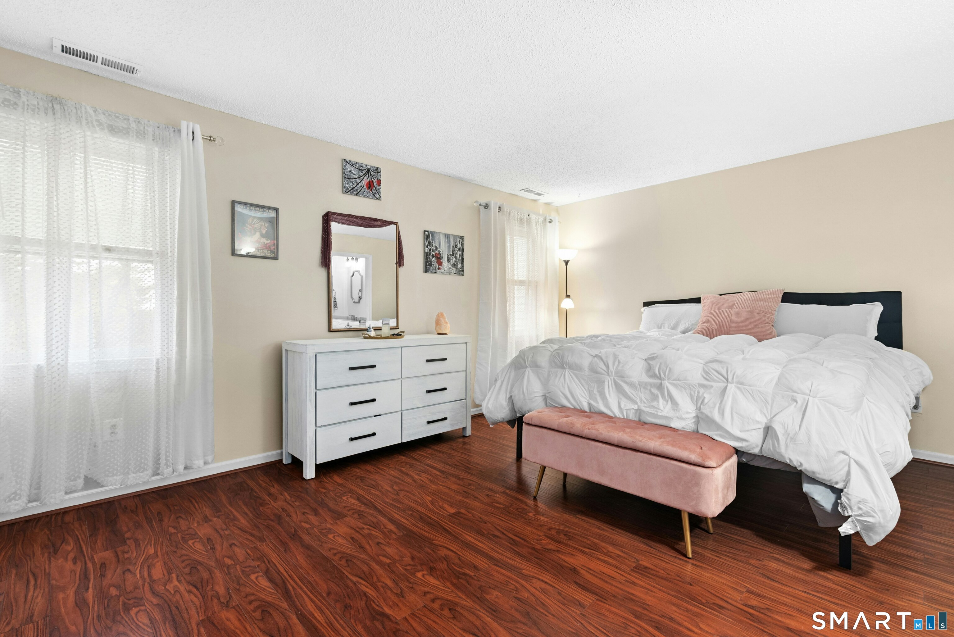 55 Mill Plain Road, Unit 193 Danbury, CT 06811 - Photo 13 of 27 a bedroom with a bed and a dresser