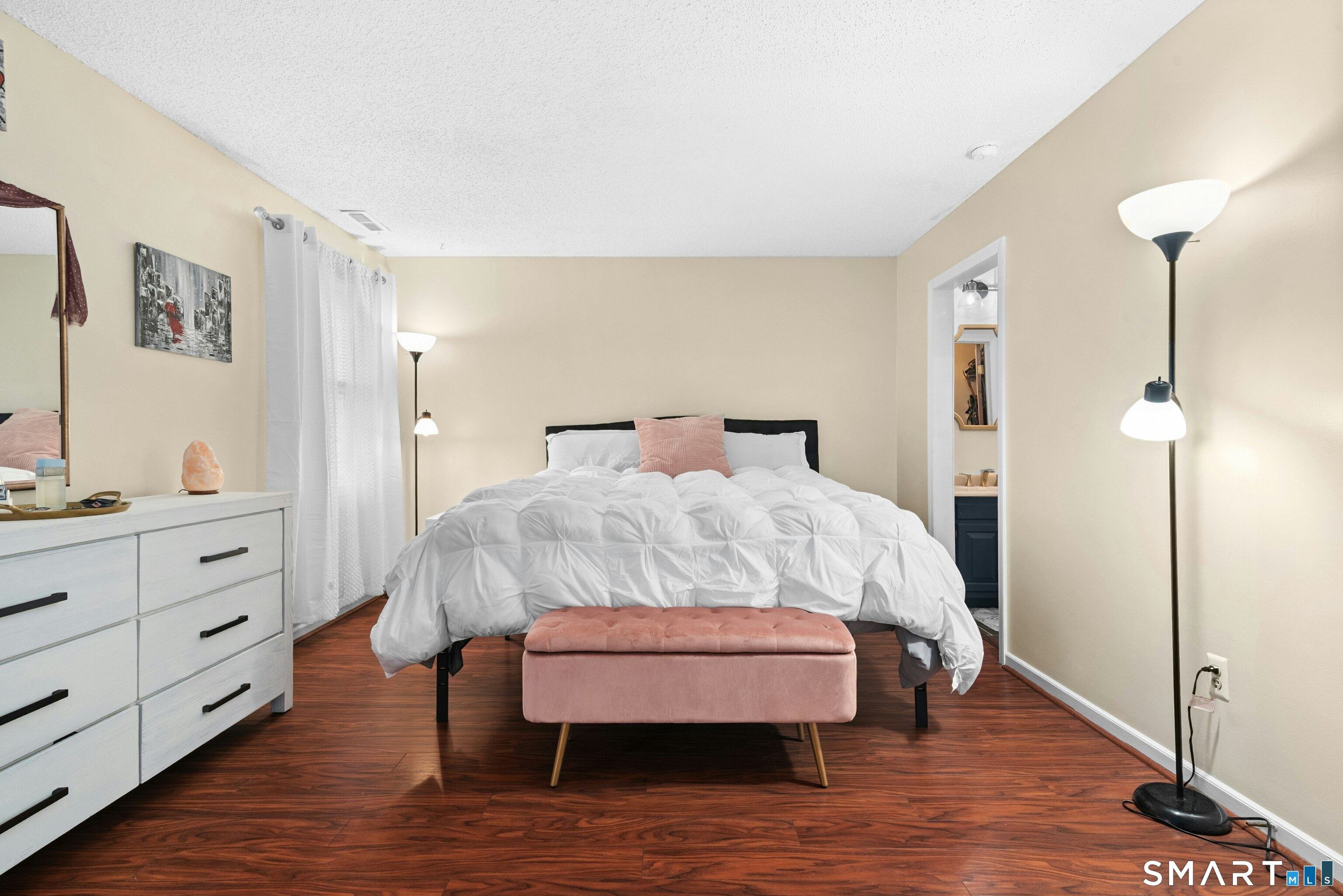 55 Mill Plain Road, Unit 193 Danbury, CT 06811 - Photo 14 of 27 a bedroom with a bed and wooden floor