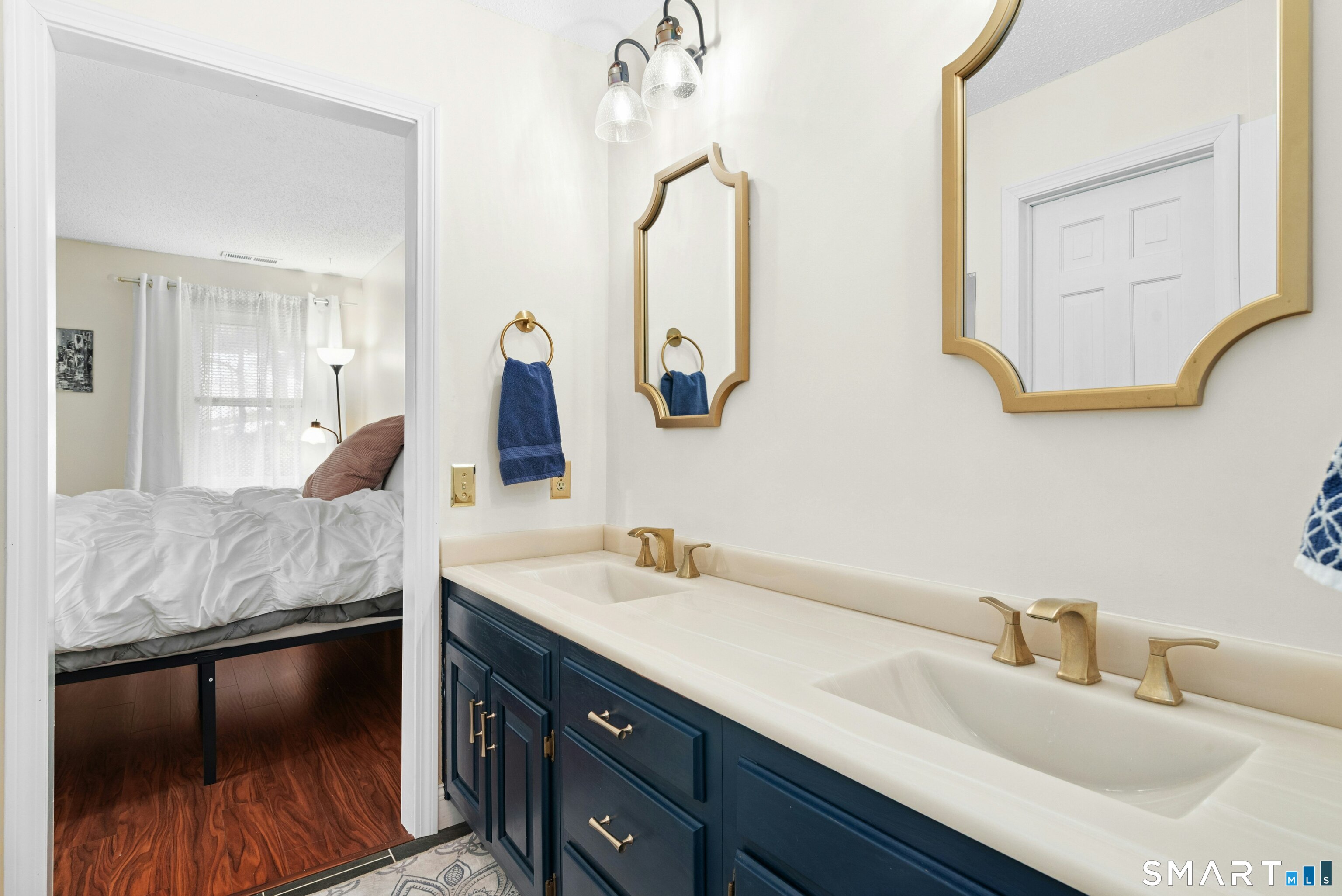 55 Mill Plain Road, Unit 193 Danbury, CT 06811 - Photo 15 of 27 a en suite bathroom with a double vanity sink and a mirror