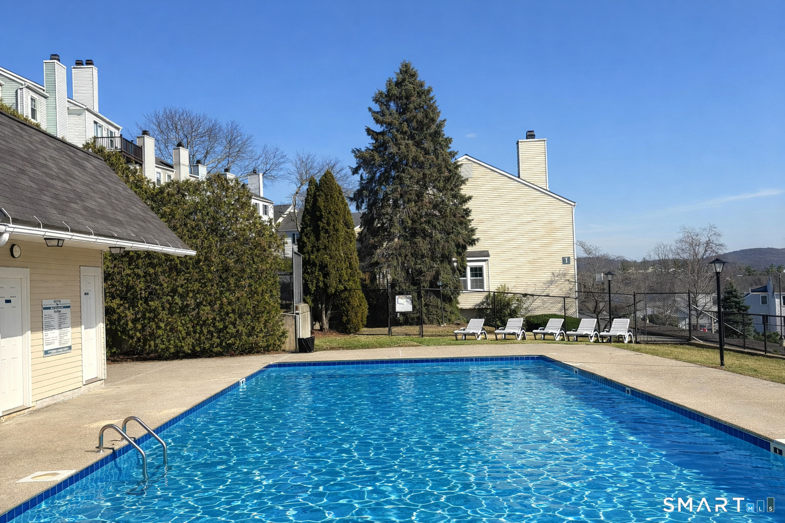 55 Mill Plain Road, Unit 193 Danbury, CT 06811 - Photo 25 of 27 a city view with tall trees