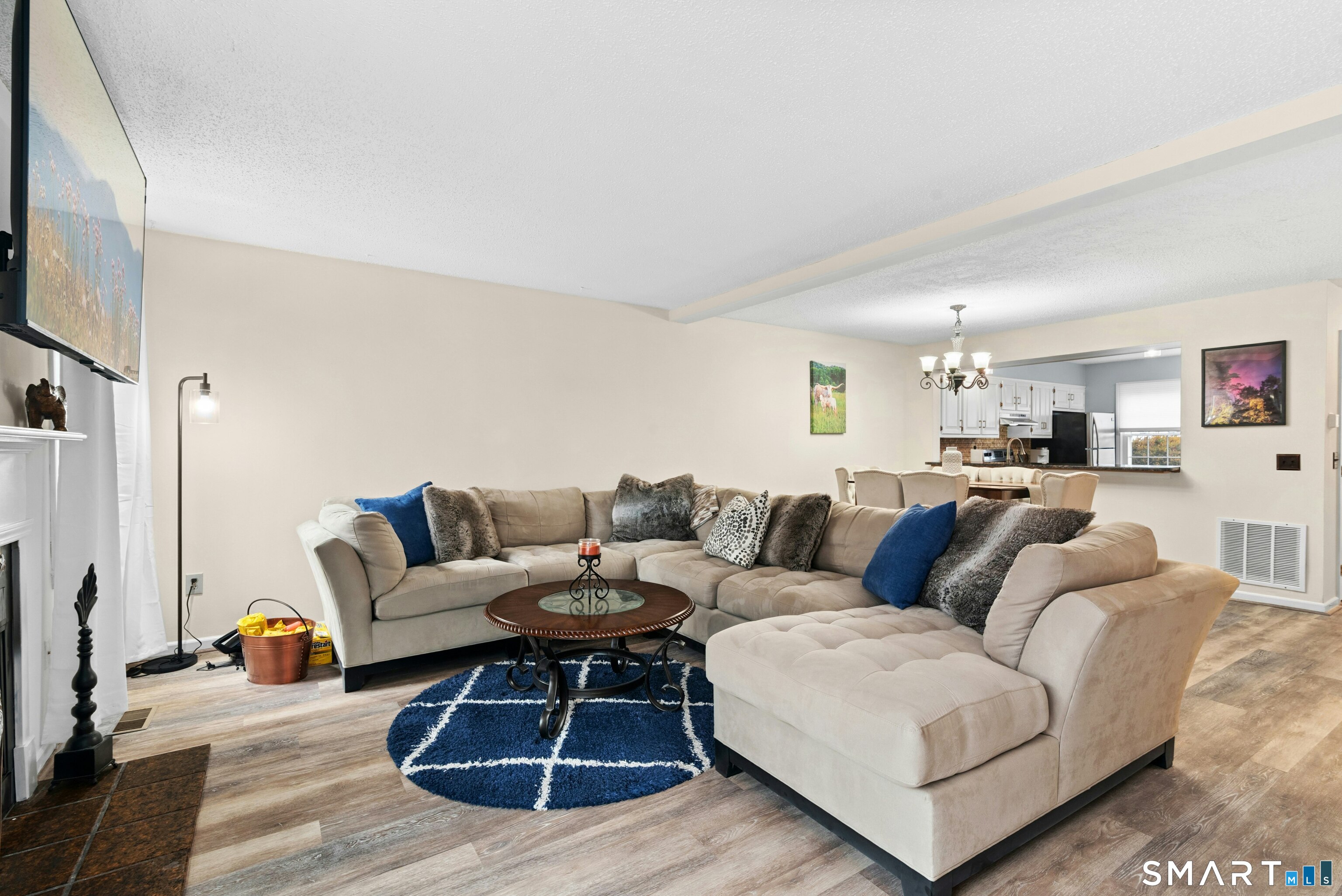 55 Mill Plain Road, Unit 193 Danbury, CT 06811 - Photo 6 of 27 a living room with furniture wooden floor and a flat screen tv