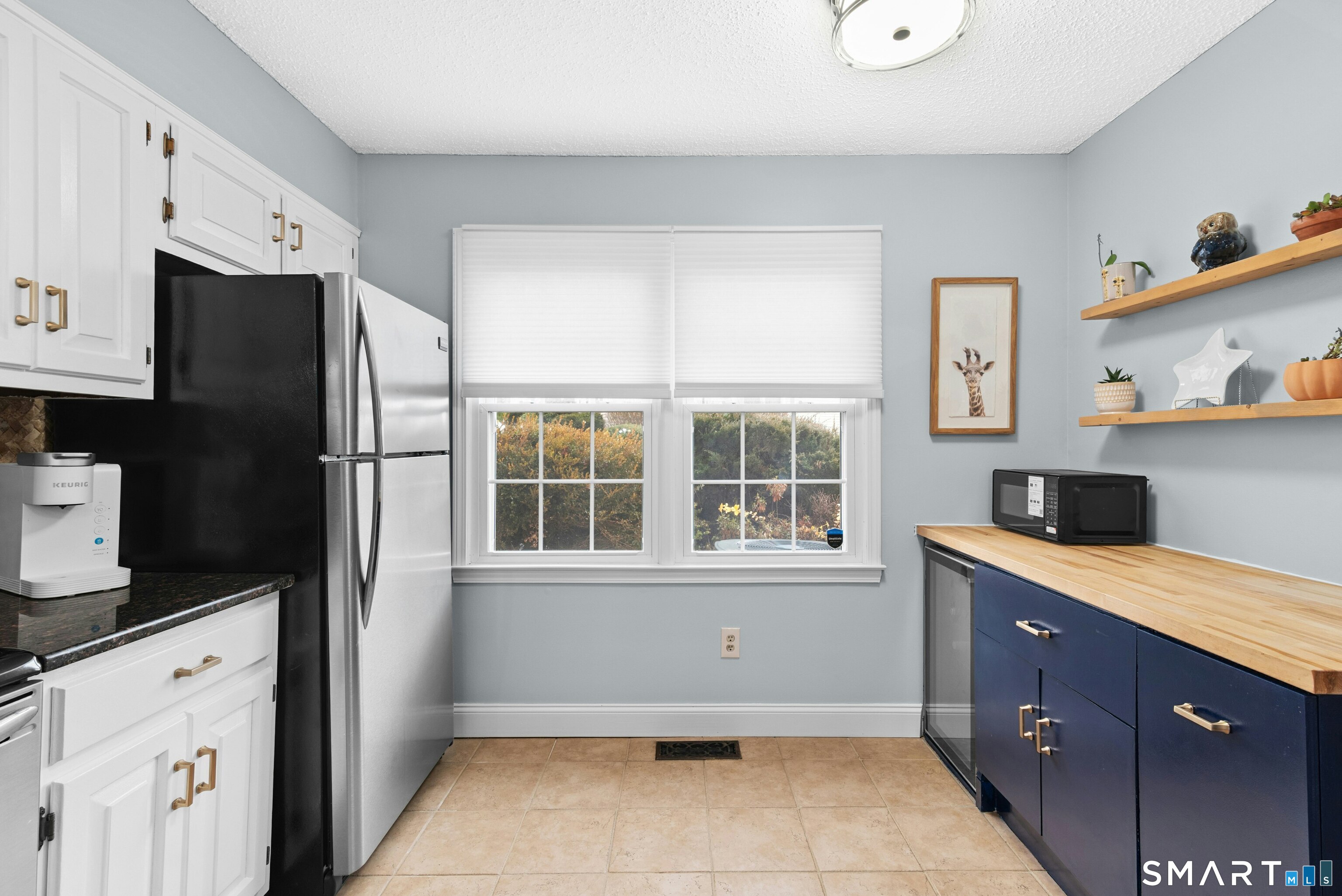 55 Mill Plain Road, Unit 193 Danbury, CT 06811 - Photo 10 of 27 a kitchen with granite countertop a refrigerator and a sink