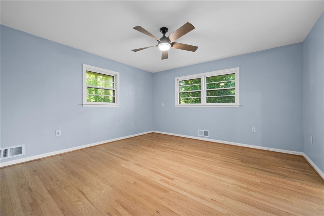 103 Satula Lane Clemson, SC 29631 - Photo 28 of 50 This airy room features abundant natural light and warm hardwood flooring, ready for your personal touch.