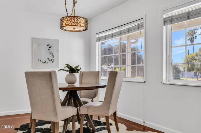 a view of a dining room with furniture window and outside view