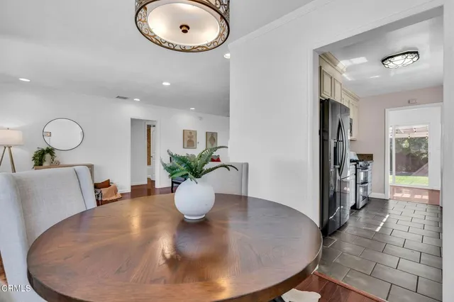 a view of a dining room with a table and chairs