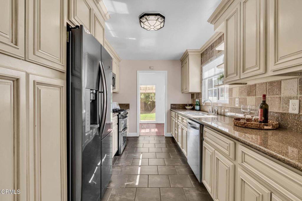 472 Geneva Avenue Claremont, CA 91711 - Photo 14 of 50 a kitchen with stainless steel appliances granite countertop a refrigerator and a sink