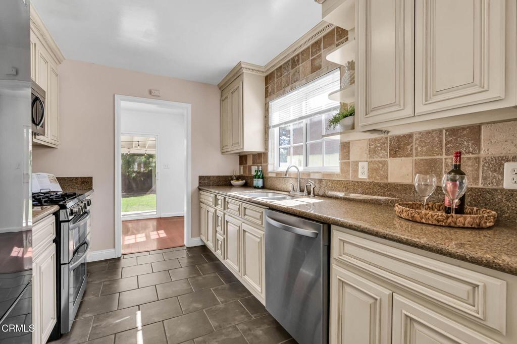 472 Geneva Avenue Claremont, CA 91711 - Photo 15 of 50 a kitchen with stainless steel appliances granite countertop a sink stove and refrigerator