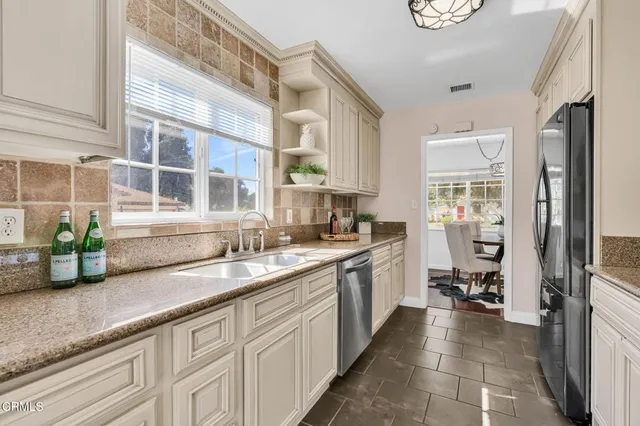 a kitchen with a sink and a window