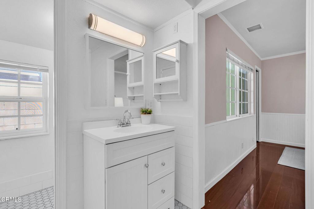 472 Geneva Avenue Claremont, CA 91711 - Photo 27 of 50 a bathroom with a sink and a mirror