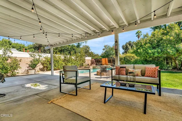 a outdoor living space with furniture and a garden