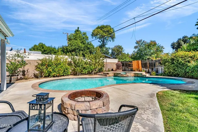 a view of a swimming pool with a patio