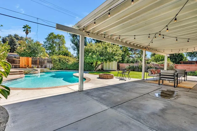 a view of a swimming pool with a patio
