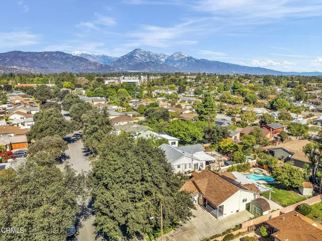 a view of a city with mountains in the background