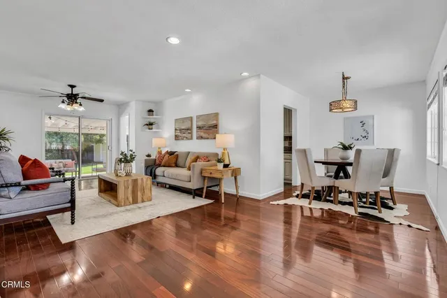 a living room with furniture window and wooden floor