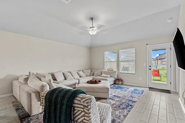 a bedroom with furniture and a window