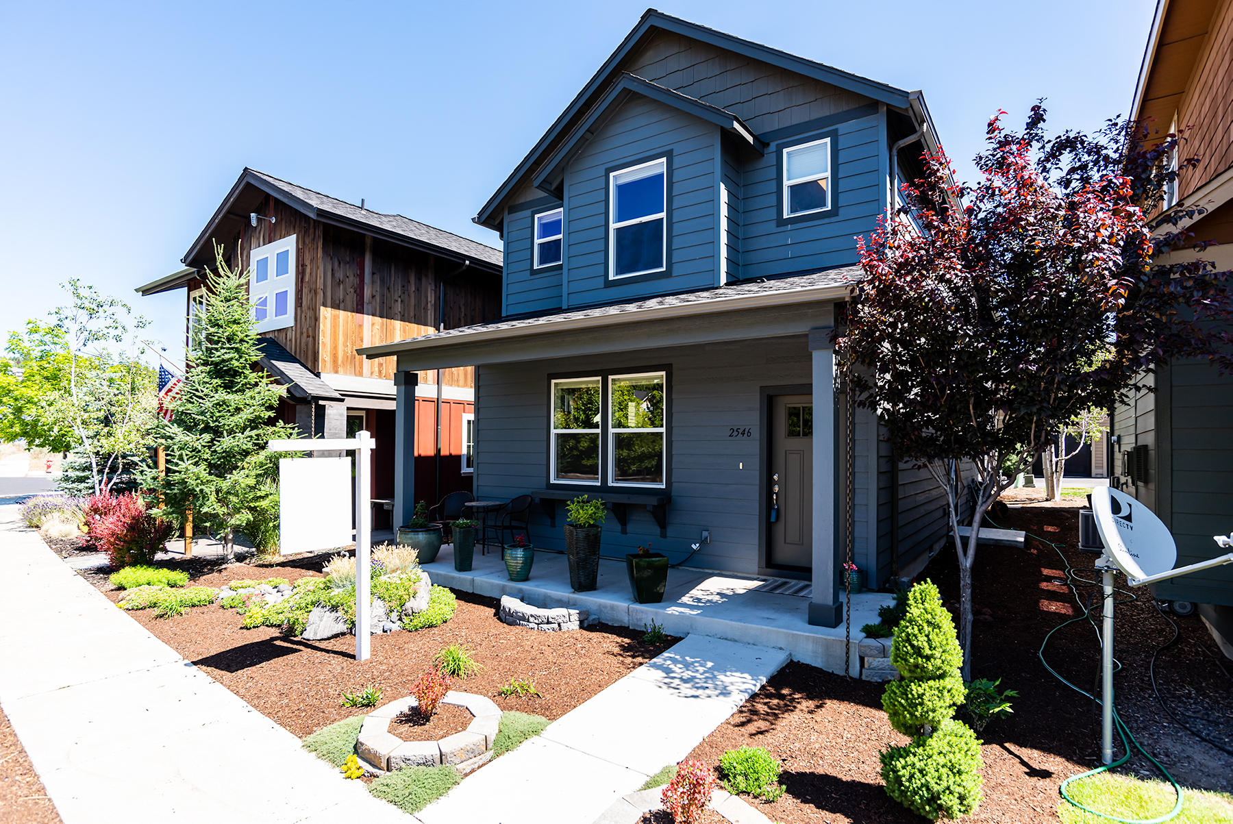 2546 Northwest Awbrey Road Bend, OR 97703 - Photo 2 of 22 a front view of a house with garden
