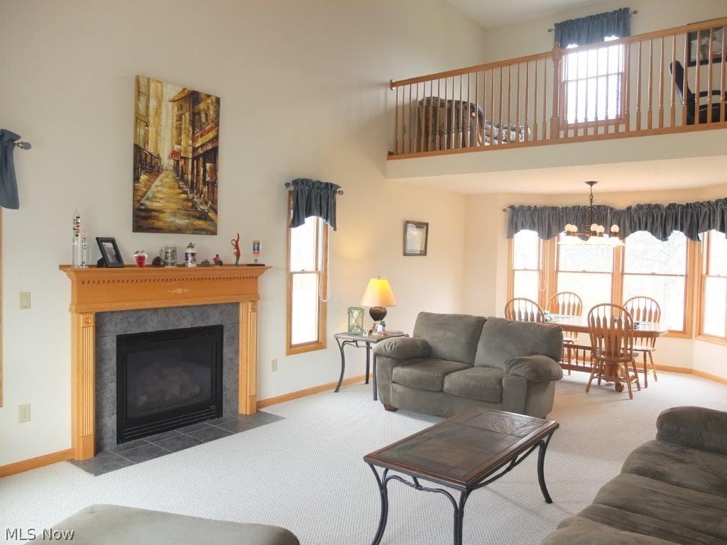 7327 Navarre Road Southwest Massillon, OH 44646 - Photo 2 of 26 Great room has 2-story vaulted ceiling and fireplace.