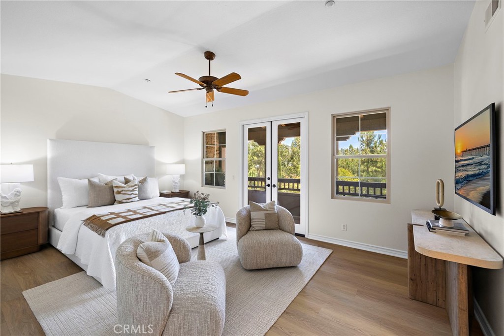 47 Tuscany Ladera Ranch, CA 92694 - Photo 11 of 28 a bedroom with a bed a couch and a flat tv screen on dresser